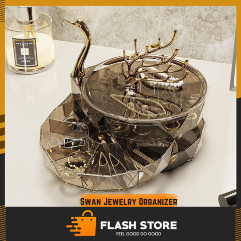 Swan jewelry organizer with jewelry on a white surface, branded as Flash Store.